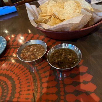 Lupe Tortilla Mexican Restaurant - Chips, salsa verde and Charro beans to start off. - Tex-Mex Near Me - Houston, Texas