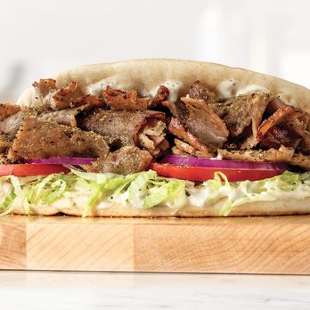 Arby's - a meat sandwich on a cutting board - Fast Food Near Me - Elk City, Oklahoma Arby's - a meat sandwich on a cutting board - Fast Food Near Me - Elk City, Oklahoma
