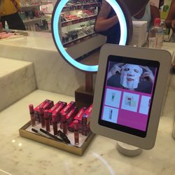 Beautiful lighting and huge mirrors for sampling makeup.