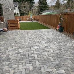 Two paver patios, decorative hvac cover, turf and stained fence - dream backyard!
