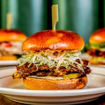 Krueger's Tavern - three burgers on plates - Bars Near Me - Cincinnati, Ohio
