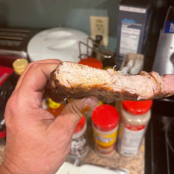 Bluebonnet Meat Company - a hand holding a piece of meat - Meat Shops Near Me - Trenton, Texas Bluebonnet Meat Company - a hand holding a piece of meat - Meat Shops Near Me - Trenton, Texas