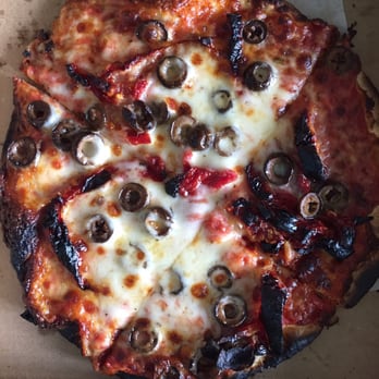 MOD Pizza - The black round things are olives. The other black things are sun-dried tomatoes and crust. Not looking very Margharita-y either. - Pizza Near Me - Cypress, Texas