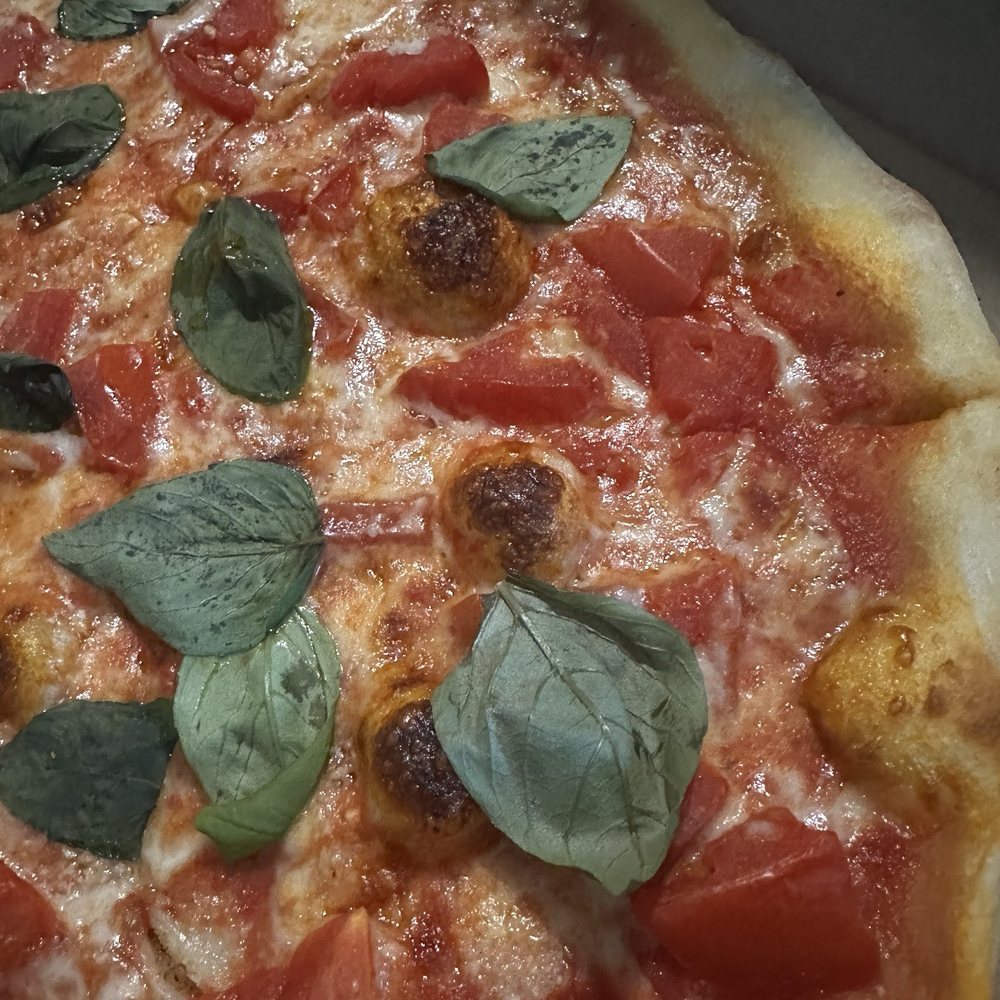 Giovanni's Pizza & Pasta - This is the margarita pizza with fresh basil on top. - Italian Near Me - Flagler Beach, Florida Giovanni's Pizza & Pasta - This is the margarita pizza with fresh basil on top. - Italian Near Me - Flagler Beach, Florida