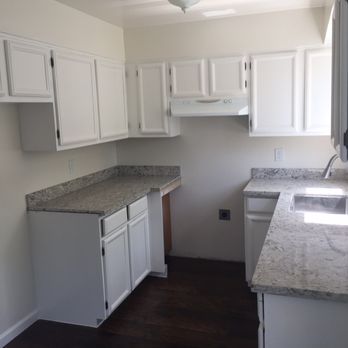 Juan Carlos' Handyman - Refaced and painted cabinets from brown to white(excellent job) Installed new granite countertops, new sink, fixtures - Handyman Near Me