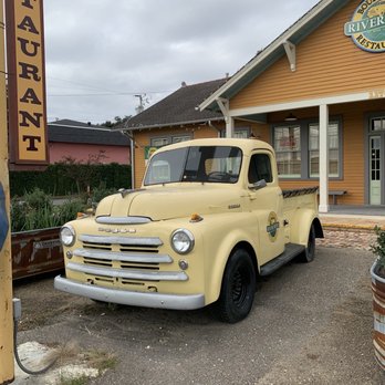 Boudreaux's River Road Restaurant - a yellow truck parked in front of a restaurant - Seafood Near Me - Saint Rose, Louisiana