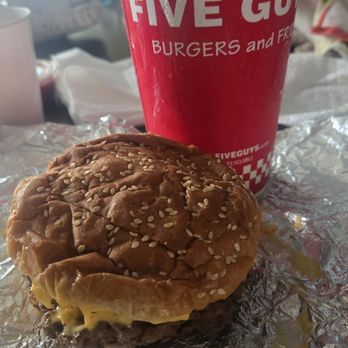 Five Guys - uninspired burger crushed by fries loaded ontop of it. - Burgers Near Me - Smyrna, Georgia