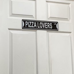 a pizza lovers street sign a pizza lovers street sign