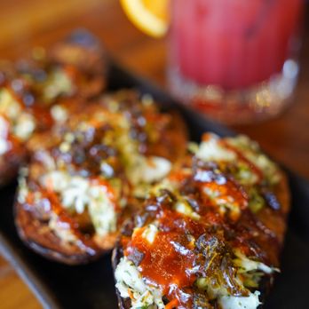 Foundry Social - a plate of appetizers and a drink - Bars Near Me - Medina, Ohio
