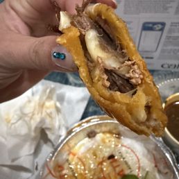 Last part of Birria Quesataco. Cheese on bottom part of taco only