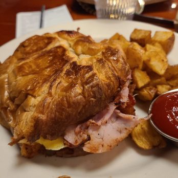 Bear Tooth Grill - Monte Cristo Croissant, strawberry sriracha jam, scrambled eggs, ham, bacon, muenster cheese with a side of potatoes - Mexican Near Me - Anchorage, Alaska