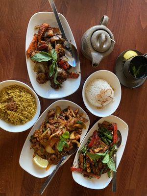 Photo of Burma Burma - Dublin, CA, US. Tofu and vegetables, coconut rice, black pepper shrimp, lamb kebat, Burmese rice, and hot tea.