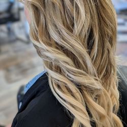 Added tape-in hair extensions to add length and volume. Done by Raha.