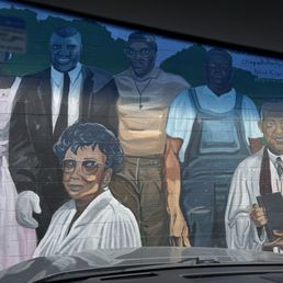 A tribute mural on the side of Walt's Grill, of several  notable Afro-Americans who were instrumental, pioneers in our country's history.