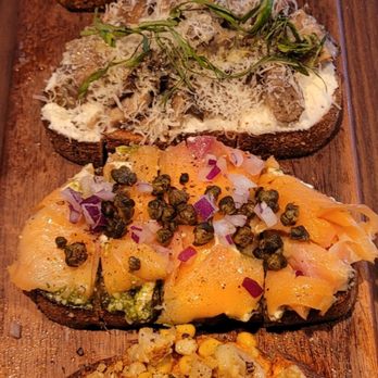 Postino Addison - Our Bruschetta Board from the top... Warm Artichoke Spread Mushrooms & Mascarpone Smoked Salmon & Pesto Mexican Street Corn - Wine Bars Near Me - Dallas, Texas Postino Addison - Our Bruschetta Board from the top... Warm Artichoke Spread Mushrooms & Mascarpone Smoked Salmon & Pesto Mexican Street Corn - Wine Bars Near Me - Dallas, Texas