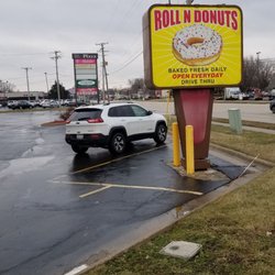 Roll N Donut Cafe - Street-side sign