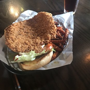 Whiskey River - Pork tenderloin sandwich and sweet potato fries- yummy! - Sports Bars Near Me - Ames, Iowa