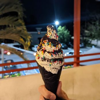 WAFU - Charcoal cone with vanilla soft serve, sprinkles and Oreos - Desserts Near Me - Orlando, Florida