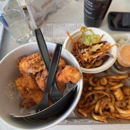 Fried chicken bucket "combo" with curly fries, cabbage, kim chi, and radish Fried chicken bucket "combo" with curly fries, cabbage, kim chi, and radish