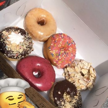 Revolution Doughnuts - from top left to right: Vanilla Bean, Raspberry Sprinkle, Toasted Almond, Hazelnut Chocolate, True Blueberry, and Dark Chocolate (I think) - Donuts Near Me - Decatur, Georgia