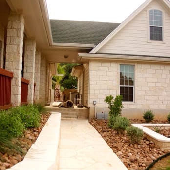 Ladera Design - Limestone wall with surrounding flower bed to cover areobic septic system. - Landscaping Near Me