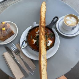 Black sesame croissant squiggle, Shakshuka, Cappuccino Black sesame croissant squiggle, Shakshuka, Cappuccino