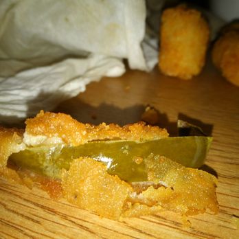 Sonic Drive-In - Looks green in photo but it's dark purple no idea what it is. It's battered, fried and in with onion rings. - Burgers Near Me - Bradenton, Florida
