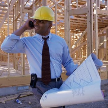 Blue Spruce Constructors - a man talking on a cell phone - General Contractors Near Me - Denver, Colorado Blue Spruce Constructors - a man talking on a cell phone - General Contractors Near Me - Denver, Colorado