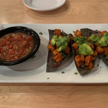 Poppycocks - Veggie Tostadas - Blue corn tostadas, black bean puree, sweet potato poblano hash, avocado, cilantro, lime, house salsa - New American Near Me - Traverse City, Michigan Poppycocks - Veggie Tostadas - Blue corn tostadas, black bean puree, sweet potato poblano hash, avocado, cilantro, lime, house salsa - New American Near Me - Traverse City, Michigan