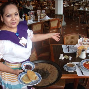 Sanborns - My waitress Sarah brings my order of huevos rancheros to the table. I can't say I was impressed about anything with this restaurant. - Department Stores Near Me - Tijuana, BCN