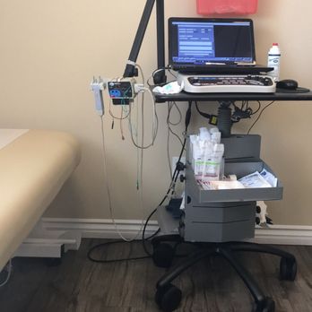 HealthyU Clinics - The machine used in the nerve testing. Clean, technologically savvy patient room. - Medical Centers Near Me - Placentia, California