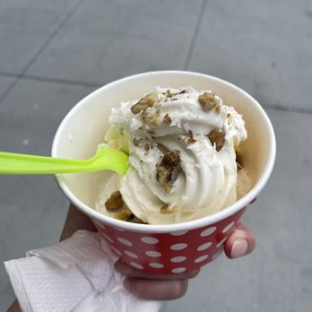 Red Cup Yogurt - a hand holding a cup of ice cream - Ice Cream & Frozen Yogurt Near Me - Oceanside, California