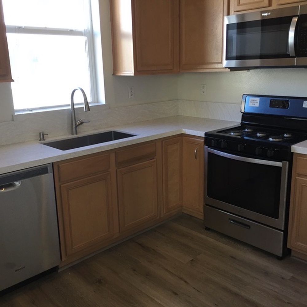 New Kitchen Quartz countertop and sink, new floors, (original cabinets) New Kitchen Quartz countertop and sink, new floors, (original cabinets)