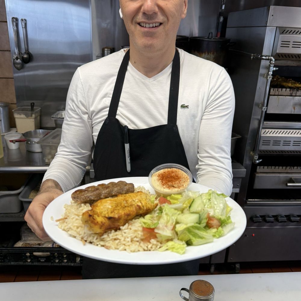 The owner serving up the lunch special. Delicious The owner serving up the lunch special. Delicious
