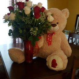 My new cuddle buddy and 24 red and white roses My new cuddle buddy and 24 red and white roses