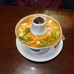 BUA Thai - Tom Yum soup. Served boiling hot and awesome flavor!