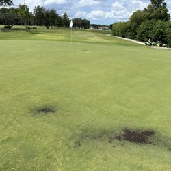 Moccasin Wallow Golf Club - Mud , and hole on another green