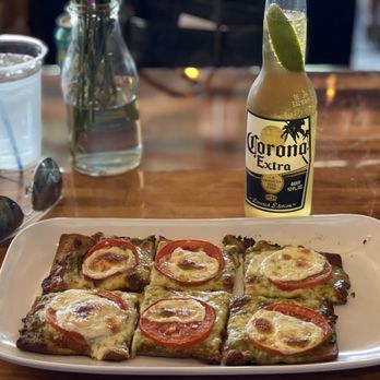 Moonlite Bay - Gluten-free-crust flatbread with pesto, tomato, and mozzarella - American Near Me - Crosslake, Minnesota