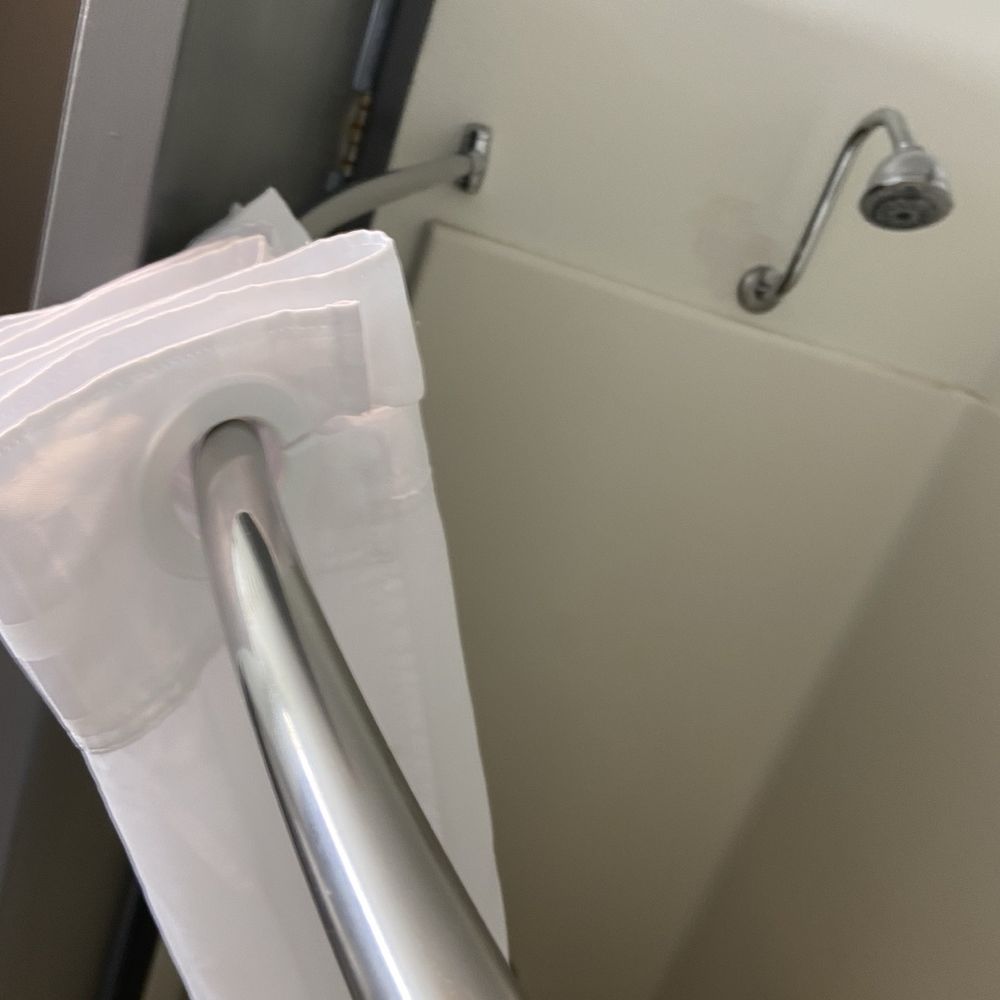 Ramada by Wyndham Waupaca - 309 shower curtain rod and door from above - Hotels Near Me - Waupaca, Wisconsin Ramada by Wyndham Waupaca - 309 shower curtain rod and door from above - Hotels Near Me - Waupaca, Wisconsin