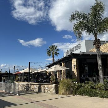 Reunion Kitchen + Drink - One side of the patio - New American Near Me - Corona, California