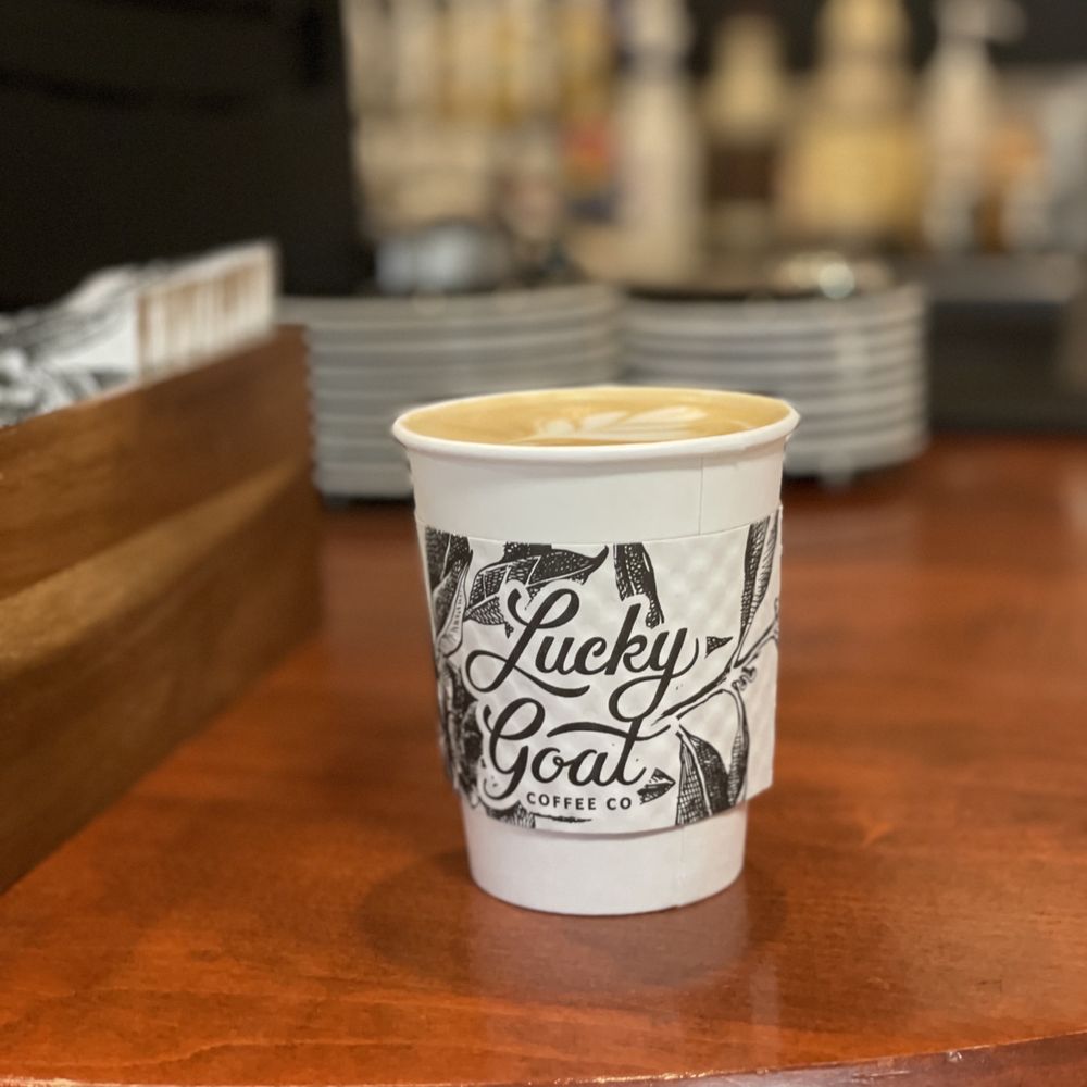 Lucky Goat Coffee - a cup of coffee on a table - Coffee & Tea Near Me - Tallahassee, Florida Lucky Goat Coffee - a cup of coffee on a table - Coffee & Tea Near Me - Tallahassee, Florida