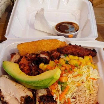The Jerk - Jerk chicken plate with rice and peas, festival, cabbage and carrot slaw, plantain, mango salsa, a slice of avocado and jerk sauce. - Caribbean Near Me - Key West, Florida The Jerk - Jerk chicken plate with rice and peas, festival, cabbage and carrot slaw, plantain, mango salsa, a slice of avocado and jerk sauce. - Caribbean Near Me - Key West, Florida