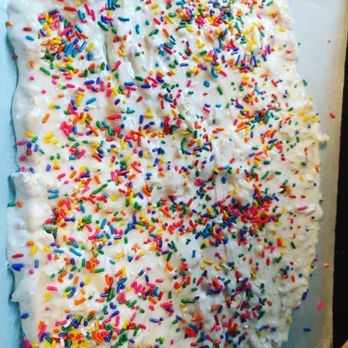 Cookies and More - a white frosted cake with sprinkles - Desserts Near Me Cookies and More - a white frosted cake with sprinkles - Desserts Near Me