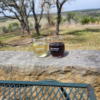 Driftwood Estate Winery - Two glasses of sophistication  Sangiovese & Semi Sweet Orange Muscat. - Wineries Near Me - Driftwood, Texas