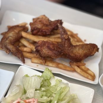 New Fortune Stone - a plate of french fries and salad - Chinese Near Me - Markham, Ontario