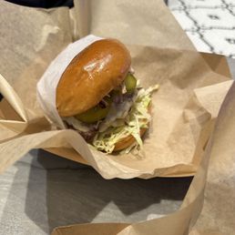 a sandwich in a paper basket