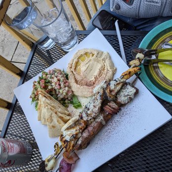 Jerusalem Garden Cafe - a plate of food on a patio table - Middle Eastern Near Me - Asheville, North Carolina Jerusalem Garden Cafe - a plate of food on a patio table - Middle Eastern Near Me - Asheville, North Carolina