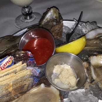Half Shell Oyster House - Half dozen oysters on the half shell with a coco runner - Seafood Near Me - Flowood, Mississippi