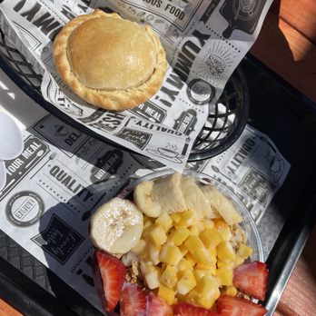 Brazuca Acaí - chicken empanada and small açaí bowl with mango, banana, strawberry and coconut flakes - Juice Bars & Smoothies Near Me - Richmond, California