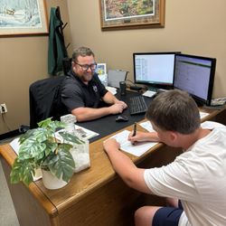 Signing papers to buy the mower